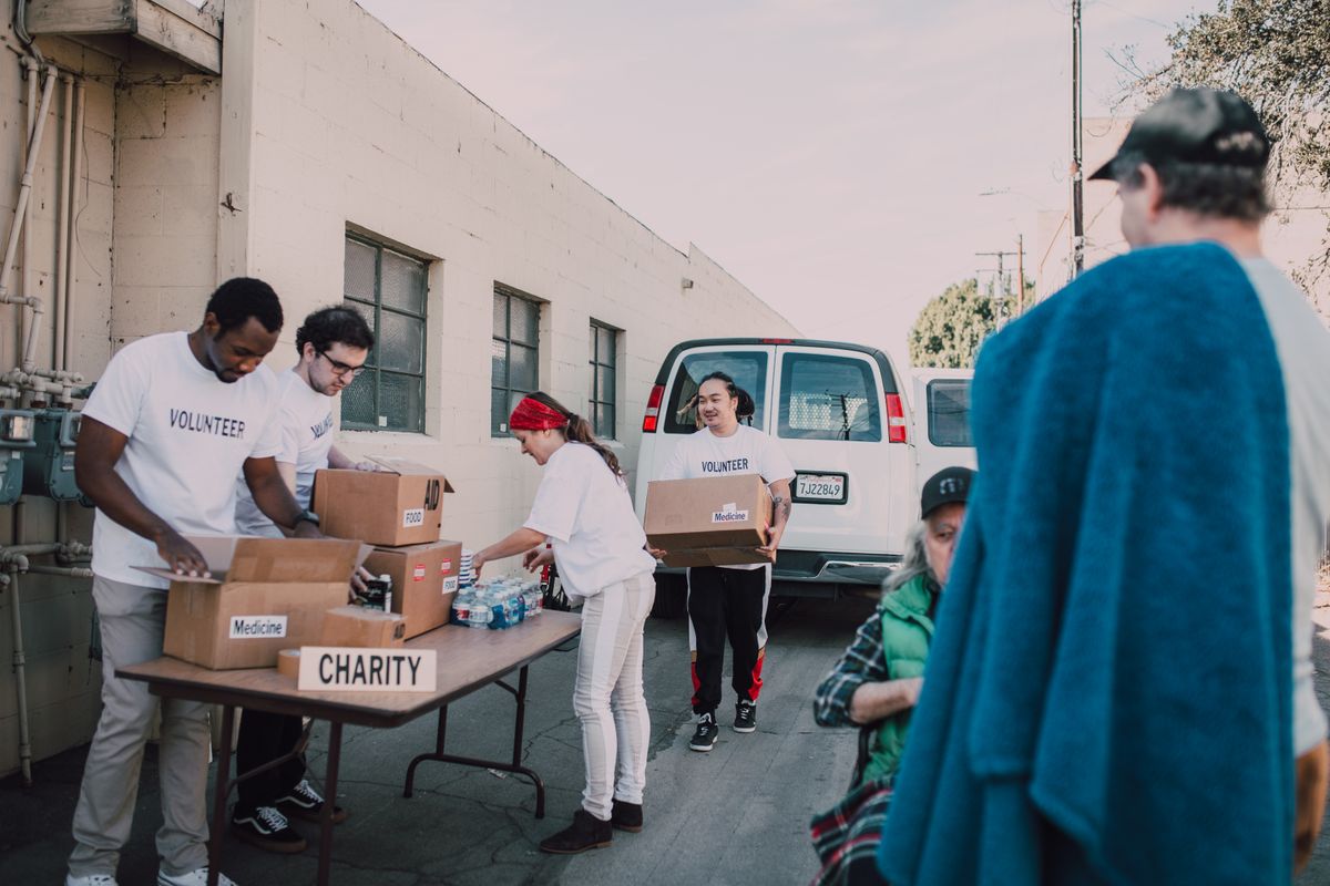 Volunteers organizing donations through community partnerships