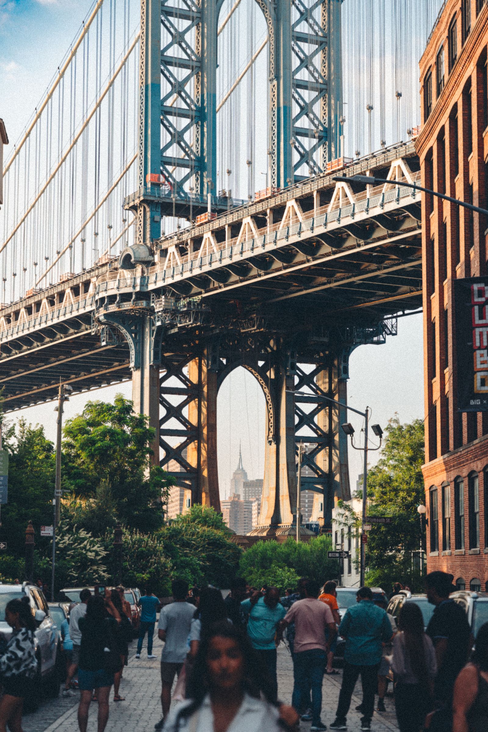 People walking near the Brooklyn Bridge in New York City for The Role of Local Philanthropy in New York Neighborhoods