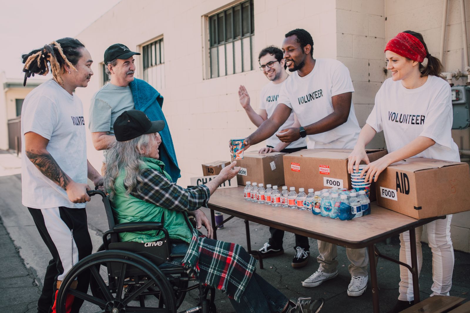 Volunteers assisting and distributing supplies in a community setting for The Future of Community Philanthropy in New York